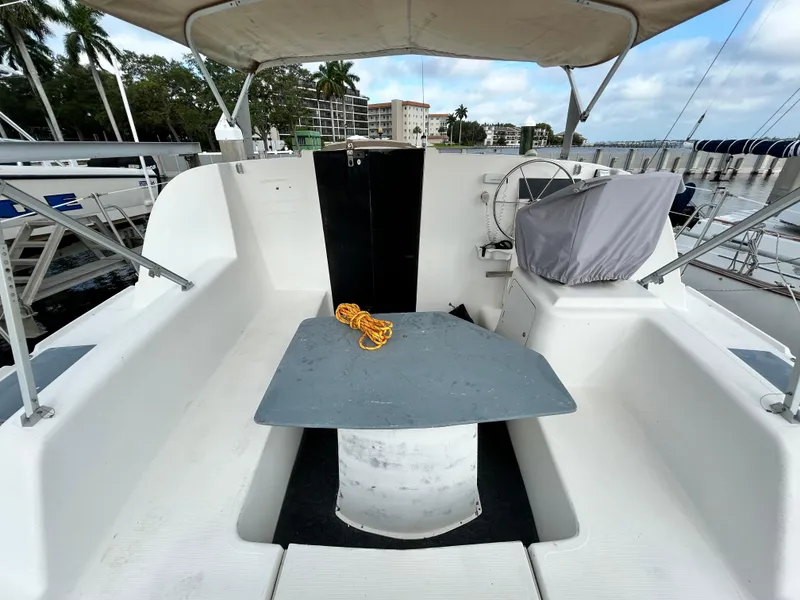 Slide: The Image of 2004 Endeavour Catamaran Victory cockpit with seating, table, and covered helm. - 33