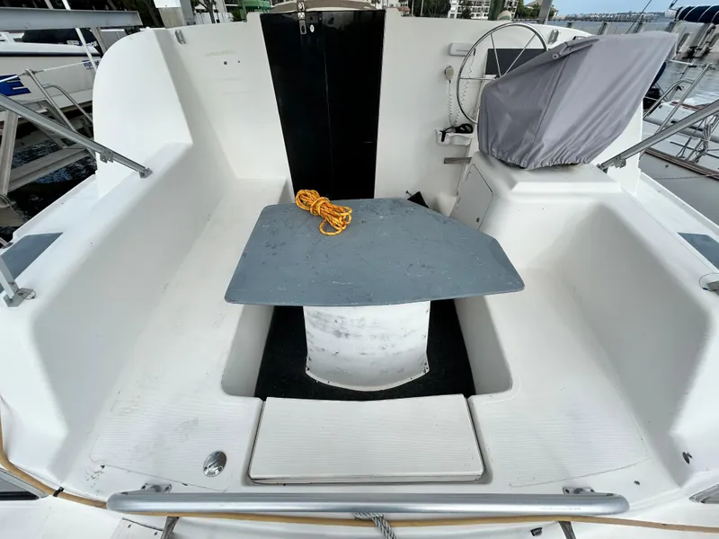 Slide: The Image of 2004 Endeavour Catamaran Victory cockpit with table and covered steering wheel. - 34