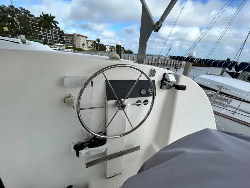 Slide: The Image of 2004 Endeavour Catamaran Victory steering wheel and control panel at marina. - 43