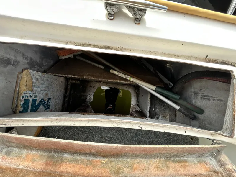 Slide: The Image of Storage compartment of a 2004 Endeavour Catamaran Victory with tools and equipment. - 44