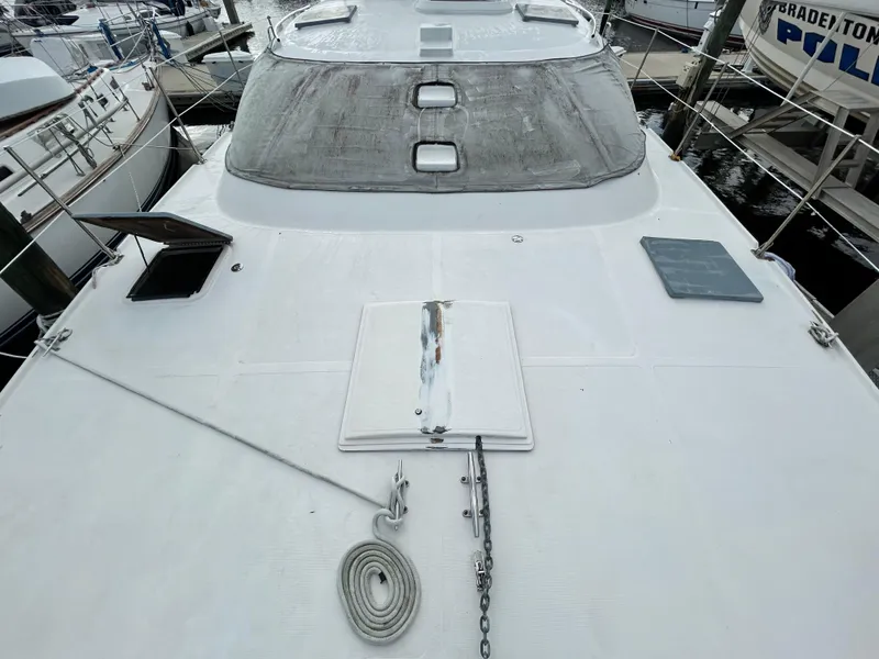 Slide: The Image of 2004 Endeavour Catamaran Victory model docked, showcasing deck and hatch details. - 8