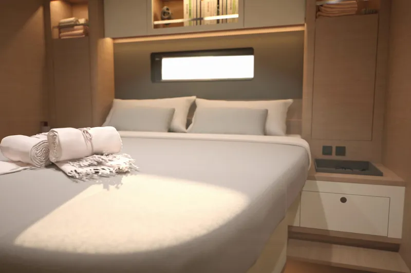 Slide: The Image of Luxurious cabin interior of 2026 Dufour 54 yacht with cozy bed and elegant decor. - 21
