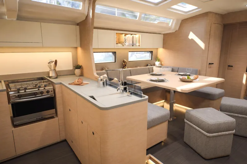 Slide: The Image of Modern interior of 2026 Dufour 54 yacht with kitchen and dining area. - 33