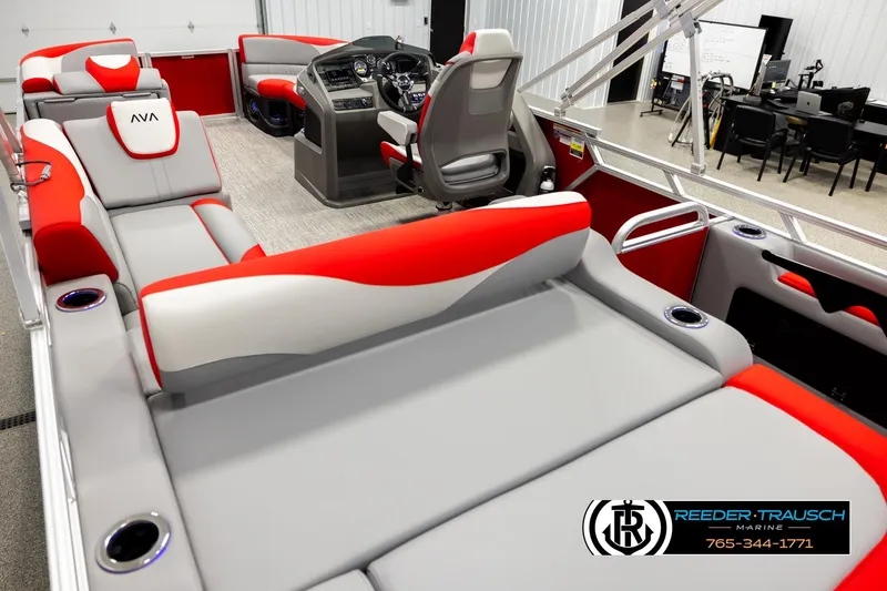 Slide: The Image of 2026 Avalon LSZ VRB boat interior with red and gray seating, steering console, and modern design. - 11