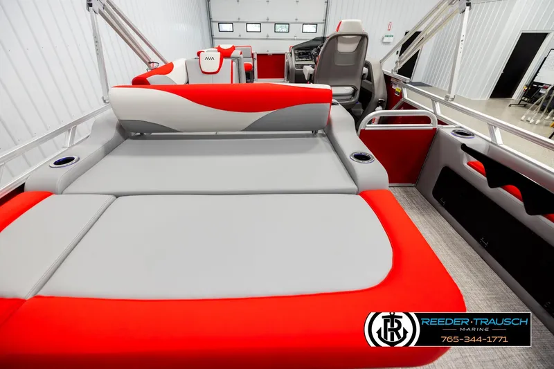 Slide: The Image of 2026 Avalon LSZ VRB boat interior with red and gray seating, cup holders, and steering console. - 16