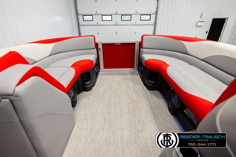 Slide: The Image of Luxurious 2026 Avalon LSZ VRB boat interior with red and gray seating in a showroom. - 18