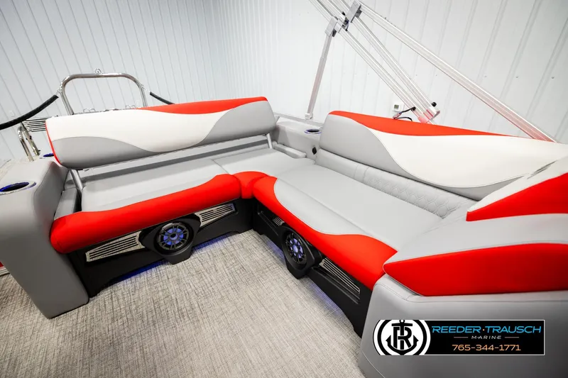 Slide: The Image of 2026 Avalon LSZ VRB boat interior with red and gray seating, featuring modern design elements. - 21