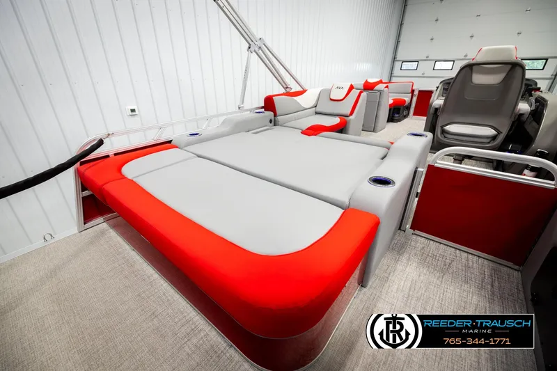 Slide: The Image of 2026 Avalon LSZ VRB boat interior with red and gray seating, cup holders, and modern design. - 23