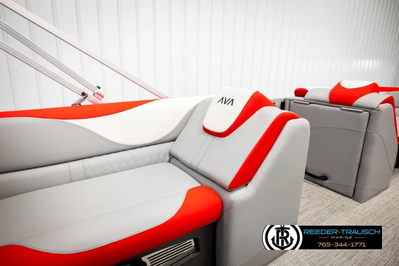 Slide: The Image of Luxurious 2026 Avalon LSZ VRB boat seating with red and gray upholstery, Reeder-Trausch Marine logo. - 27