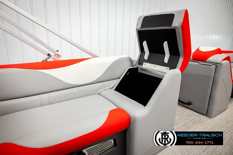 Slide: The Image of 2026 Avalon LSZ VRB boat interior with red and gray seating, storage compartment open. - 28