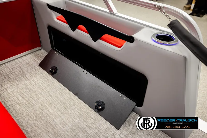 Slide: The Image of 2026 Avalon LSZ VRB boat interior with storage compartment and cup holder. - 32