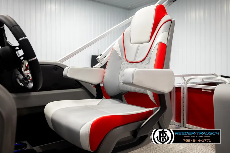 Slide: The Image of 2026 Avalon LSZ VRB boat seat with red and gray design in showroom. - 42