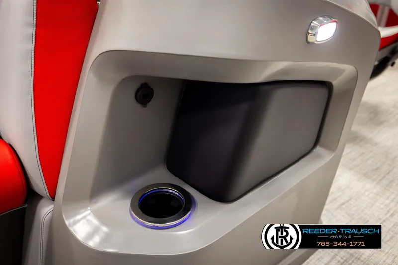 Slide: The Image of 2026 Avalon LSZ VRB boat interior with cup holder and red seating. - 46