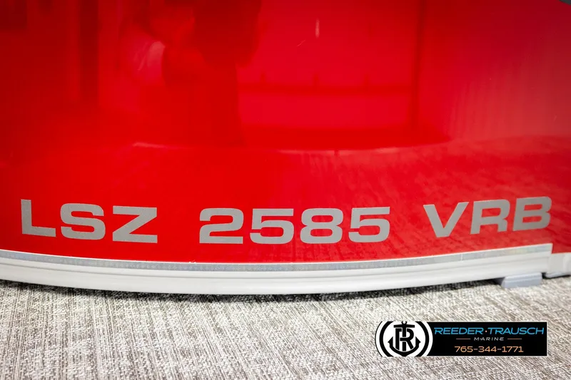 Slide: The Image of Red Avalon LSZ 2585 VRB boat with Reeder-Trausch Marine logo. - 50