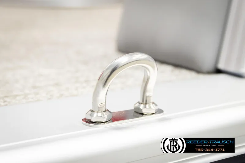 Slide: The Image of 2026 Avalon LSZ VRB boat detail with metal cleat and Reeder-Trausch Marine logo. - 53