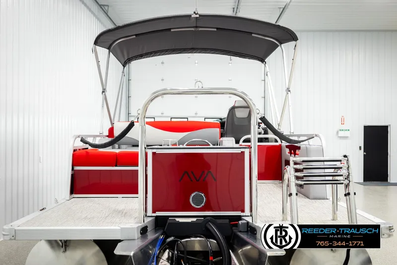 Slide: The Image of 2026 Avalon LSZ VRB pontoon boat with red seating and canopy in showroom. - 7