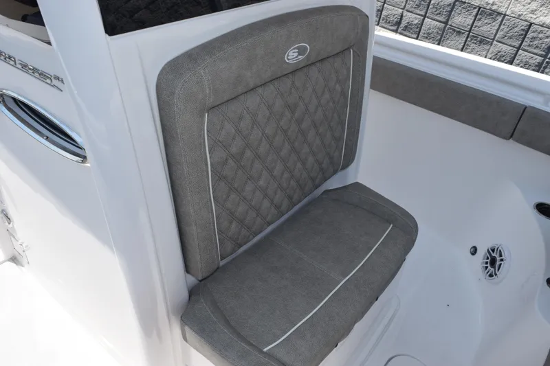 Slide: The Image of 2026 Sea Hunt Ultra 265 SE boat seat with gray upholstery and diamond stitching. - 13