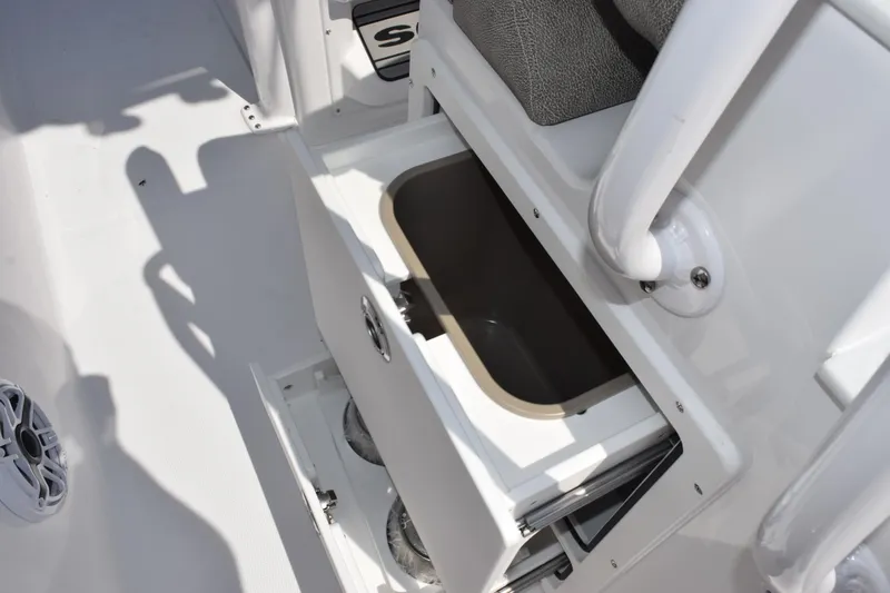 Slide: The Image of 2026 Sea Hunt Ultra 265 SE boat storage compartment with open lid. - 20
