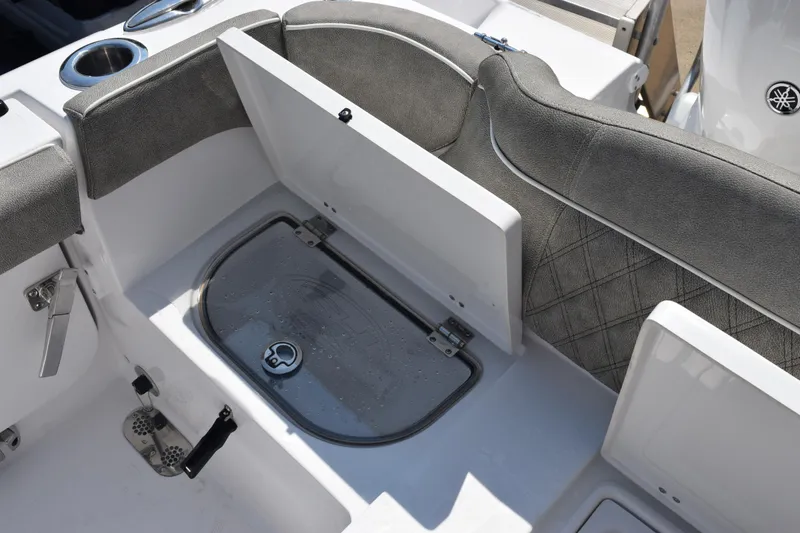 Slide: The Image of 2026 Sea Hunt Ultra 265 SE boat interior with open storage compartment. - 24