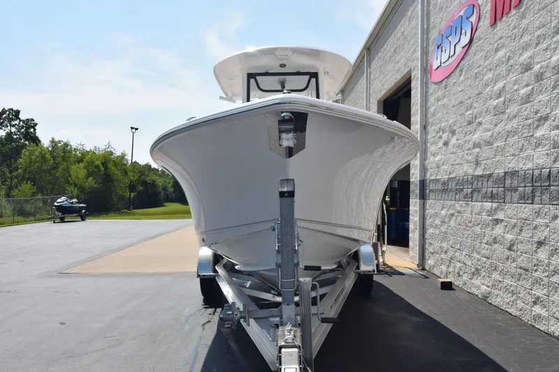 Slide: The Image of 2026 Sea Hunt Ultra 265 SE boat on trailer outside dealership. - 3