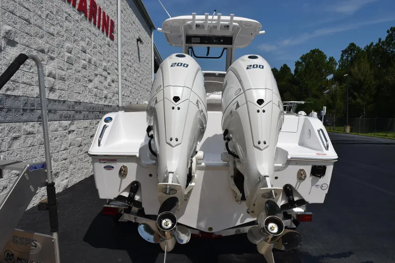 Slide: The Image of 2026 Sea Hunt Ultra 265 SE with dual 200 horsepower engines, rear view. - 5