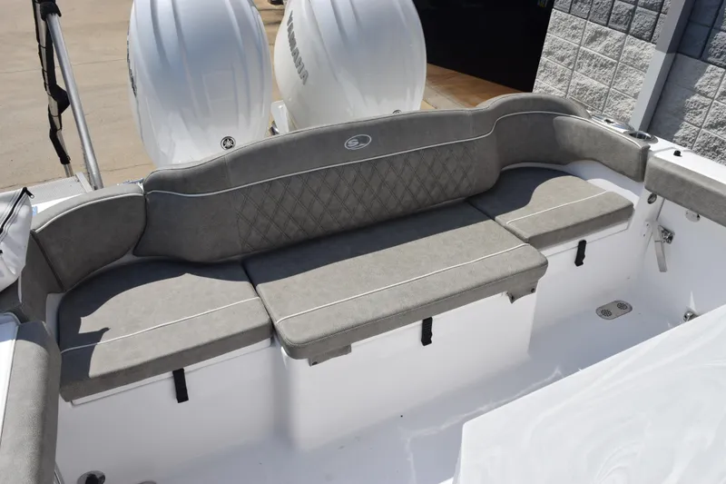 Slide: The Image of 2026 Sea Hunt Ultra 265 SE boat with cushioned seating and dual Yamaha engines. - 6