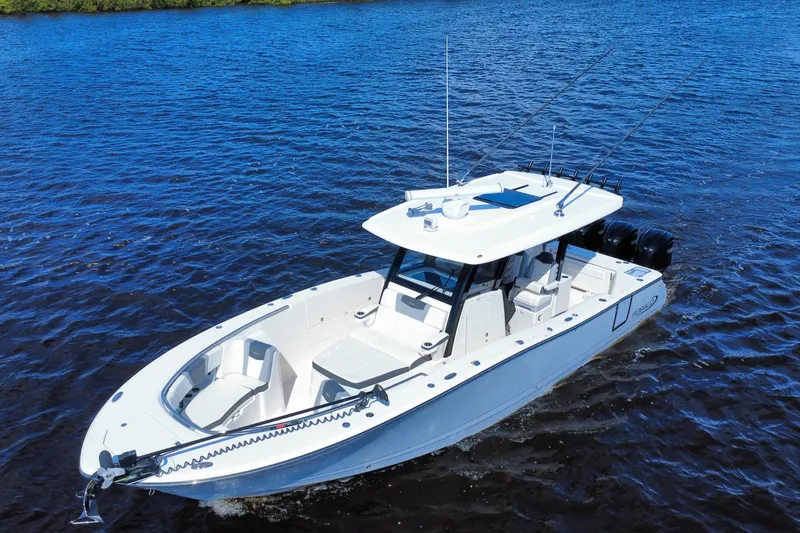 Slide: The Image of 2022 Robalo R360 Center Console boat cruising on blue water. - 11