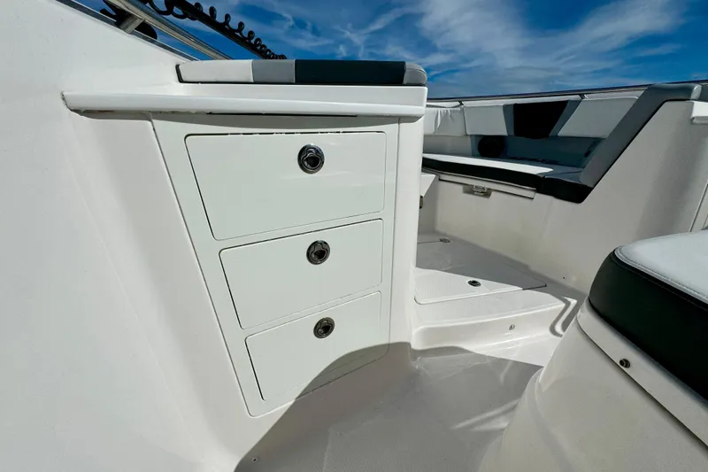 Slide: The Image of 2022 Robalo R360 Center Console interior with storage drawers and seating. - 39