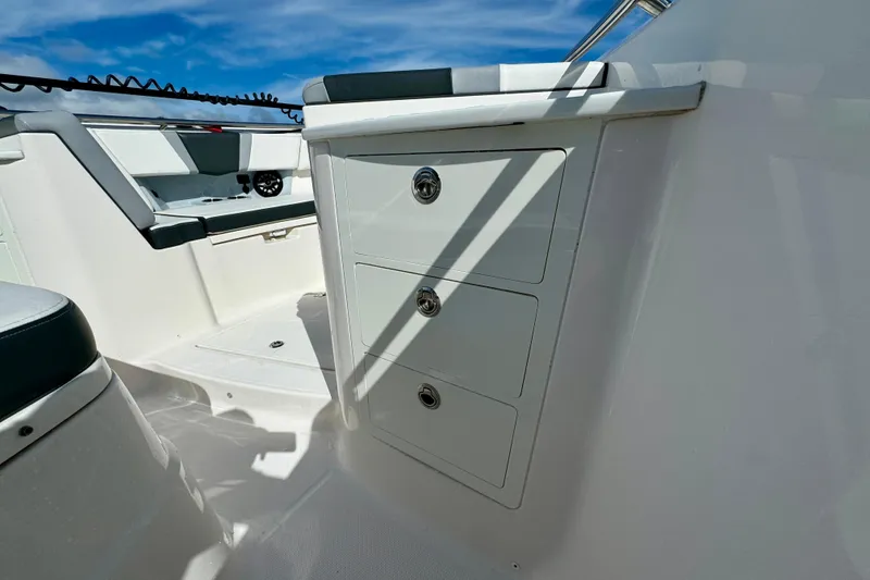 Slide: The Image of 2022 Robalo R360 Center Console interior with storage drawers and seating. - 40
