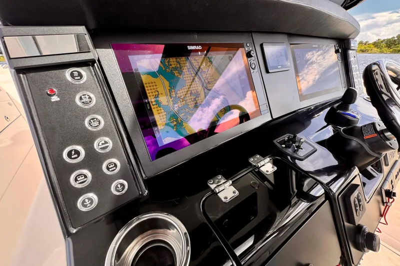 Slide: The Image of 2022 Robalo R360 Center Console dashboard with navigation screens and control panel. - 48