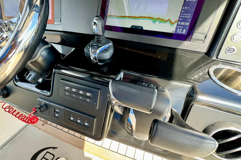 Slide: The Image of 2022 Robalo R360 Center Console dashboard with advanced controls and navigation display. - 49
