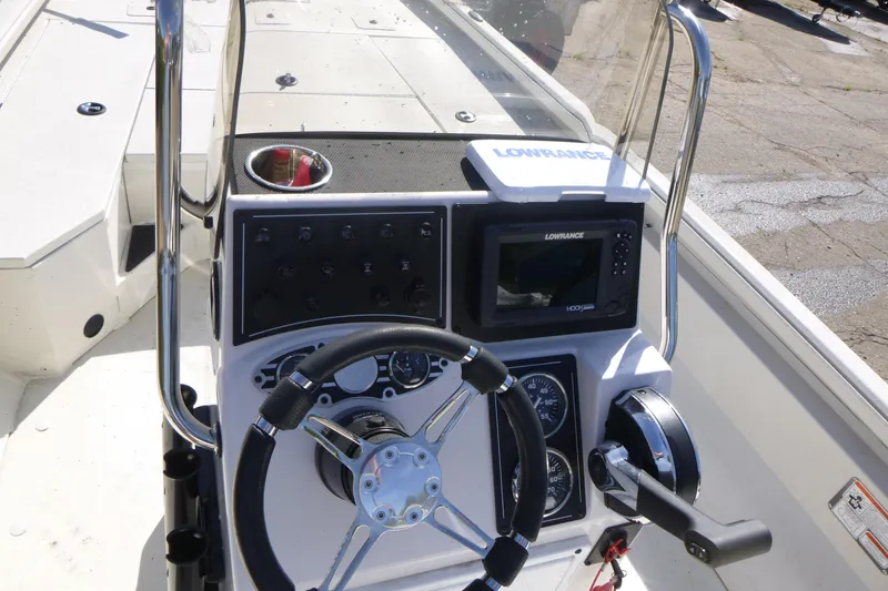 Slide: The Image of 2024 Ranger RB200 boat console with steering wheel and Lowrance electronics. - 14