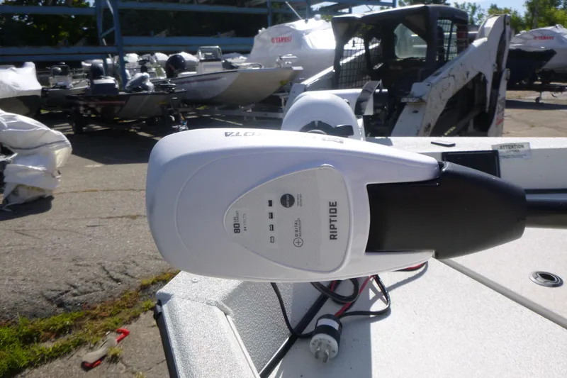 Slide: The Image of 2024 Ranger RB200 boat with Riptide trolling motor in a marina setting. - 8