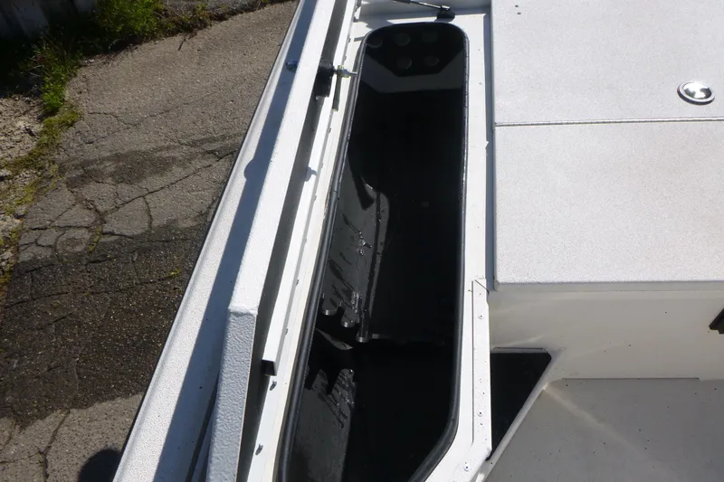 Slide: The Image of 2024 Ranger RB200 boat interior storage compartment, white and black design. - 9