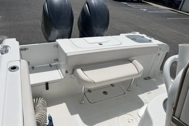 Slide: The Image of 2021 Sea Hunt Gamefish 25 boat interior with dual engines and seating area. - 15