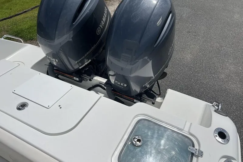 Slide: The Image of 2021 Sea Hunt Gamefish 25 with dual Yamaha outboard motors, rear deck view. - 17