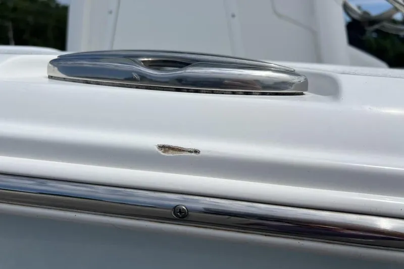 Slide: The Image of Close-up of a 2021 Sea Hunt Gamefish 25 boat with a small surface scratch. - 26