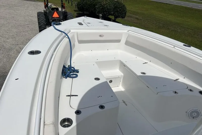 Slide: The Image of 2021 Sea Hunt Gamefish 25 boat interior with seating and storage compartments. - 9