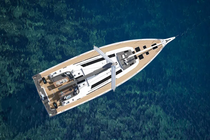 Slide: The Image of Aerial view of 2026 Dufour 54 yacht on clear blue water. - 1
