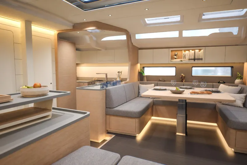 Slide: The Image of Luxurious interior of 2026 Dufour 54 yacht with modern dining area and elegant lighting. - 19