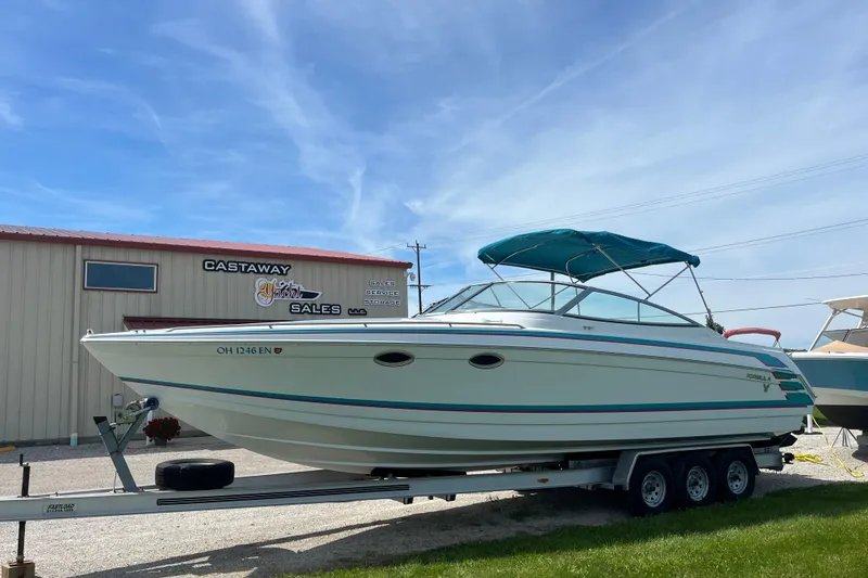 Slide: The Image of 1996 Formula 330 Sun Sport boat on trailer at Castaway Yacht Sales. - 1