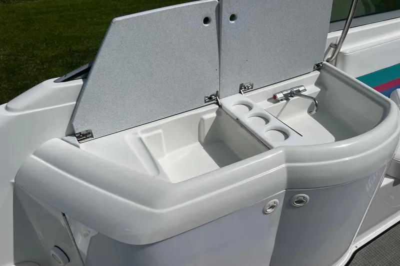 Slide: The Image of 1996 Formula 330 Sun Sport boat sink with cup holders and faucet. - 10
