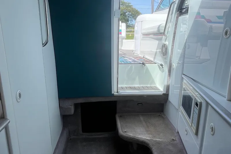 Slide: The Image of Interior view of 1996 Formula 330 Sun Sport boat, featuring cabin entrance and compact amenities. - 17