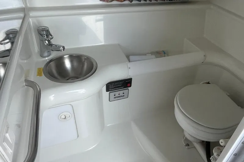 Slide: The Image of 1996 Formula 330 Sun Sport boat bathroom with sink and toilet. - 20