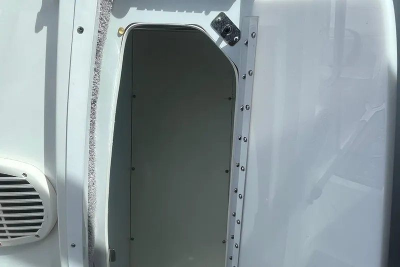 Slide: The Image of Open compartment door on a 1996 Formula 330 Sun Sport boat. - 23
