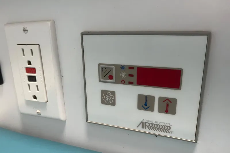 Slide: The Image of Control panel and outlet on a 1996 Formula 330 Sun Sport boat. - 24