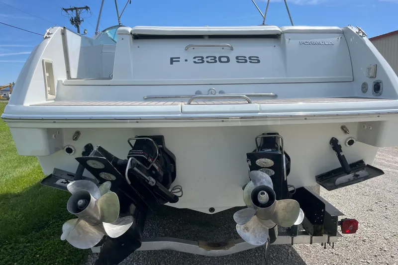 Slide: The Image of Rear view of a 1996 Formula 330 Sun Sport boat with dual propellers. - 5
