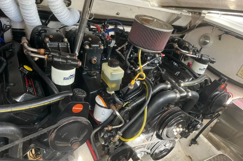 Slide: The Image of Engine compartment of a 1996 Formula 330 Sun Sport boat, showcasing mechanical components. - 7