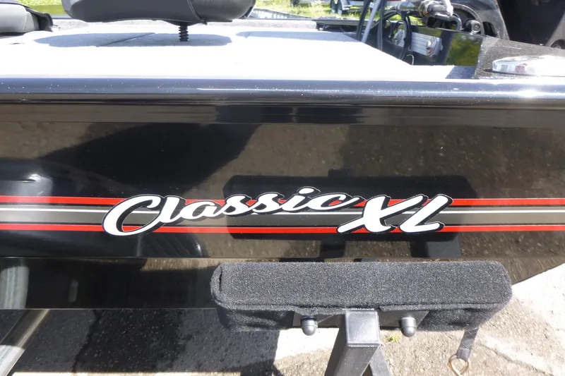 Slide: The Image of 2026 Tracker Bass Tracker Classic XL boat with sleek black and red design. - 15