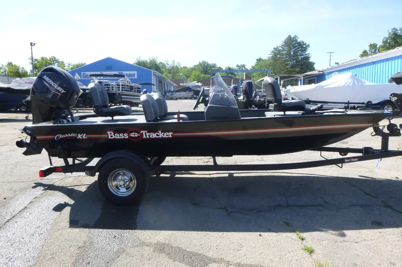 Slide: The Image of 2026 Tracker Bass Tracker Classic XL boat on trailer in outdoor setting. - 4